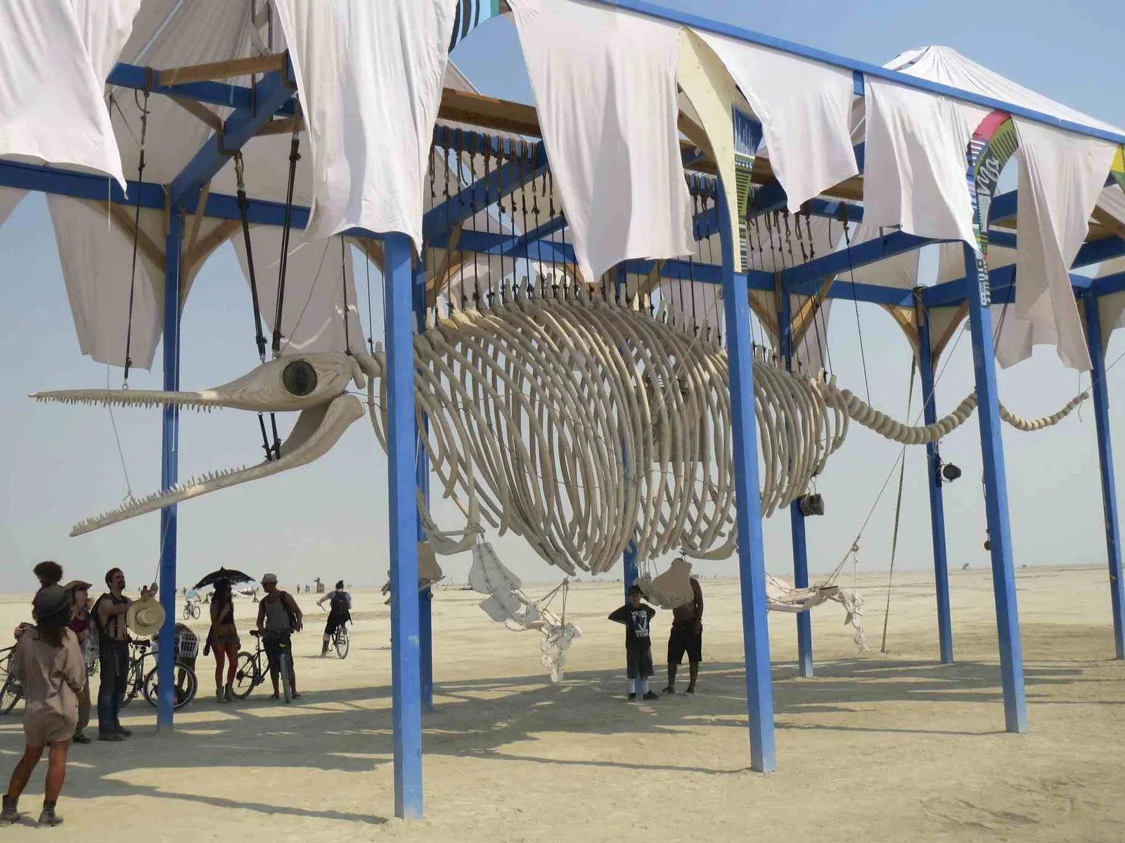 A giant ichthyosaur mobile puppet art installation at Burning Man