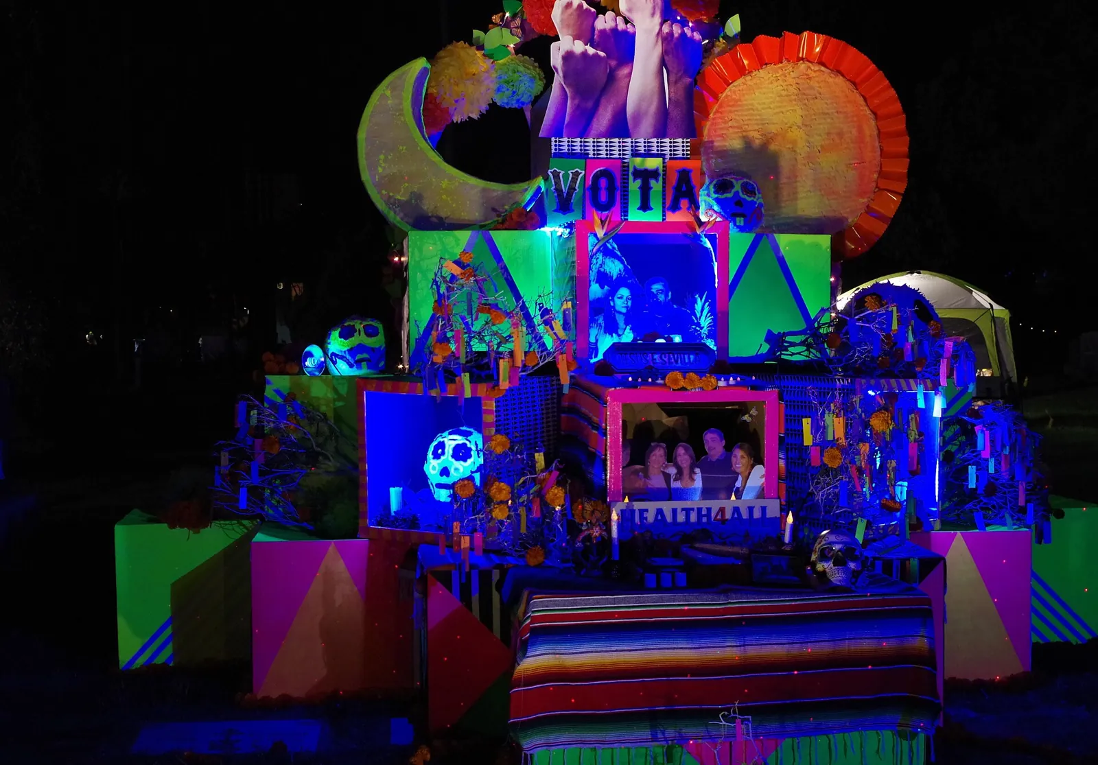 A shrine of photographs, candles and marigolds at Día de los Muertos, Hollywood Forever Cemetery, Los Angeles