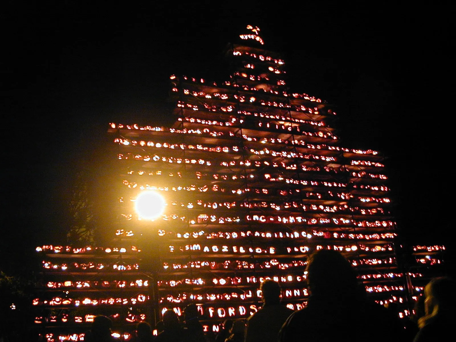 Jack-o-lanterns stacked on the town common at the Keene Pumpkin Festival, New Hampshire
