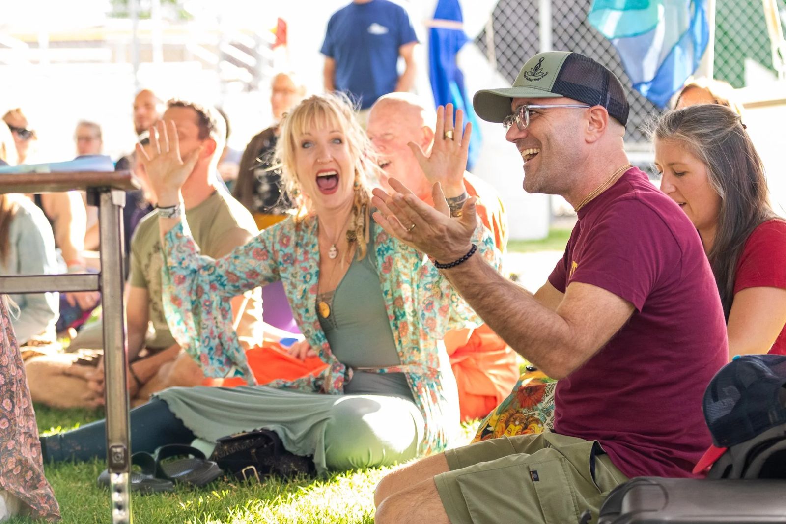 Laughing audience claps along at a Grand Valley Yoga Fest kirtan session