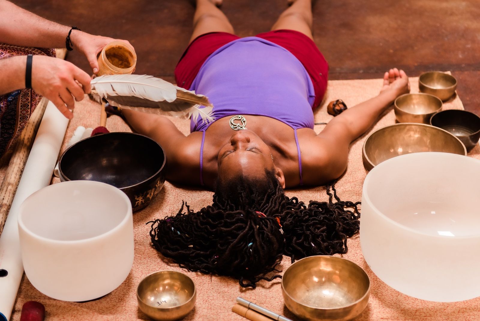 Sound-bath session with singing bowls and a feather at Kentucky Yoga Festival