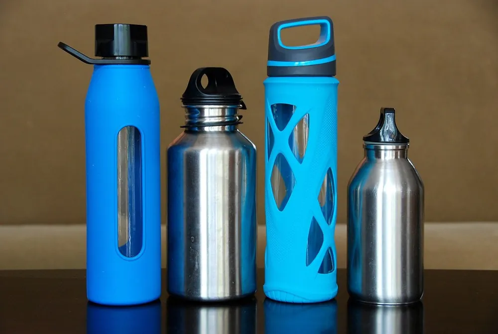 Four reusable water bottles in a row