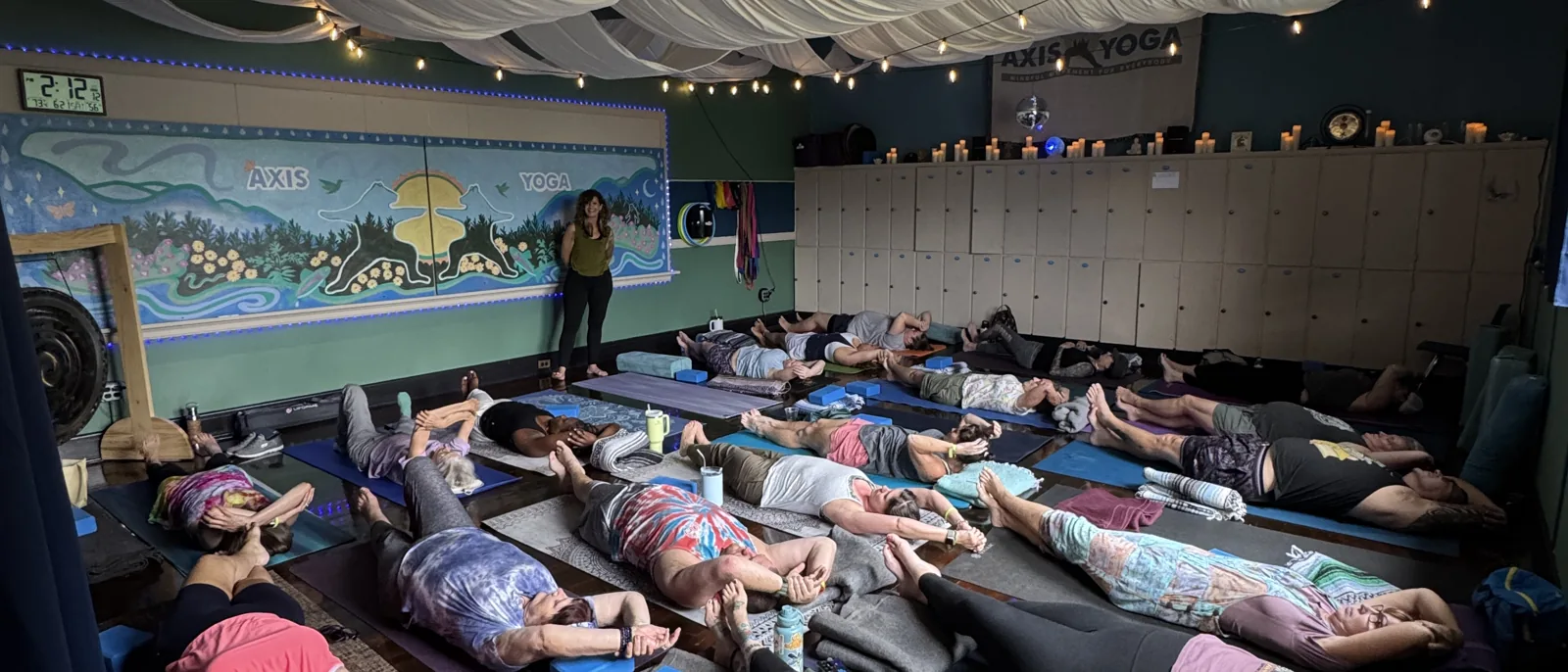 Candle-lit yin session with draped canopy at a Smoky Mountain Yoga Fest studio partner