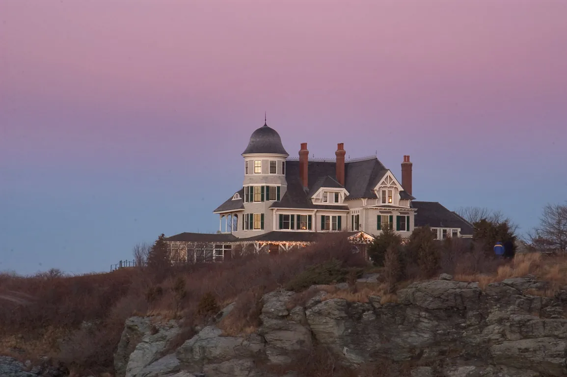 Castle Hill Inn on its rocky point above Narragansett Bay at dusk