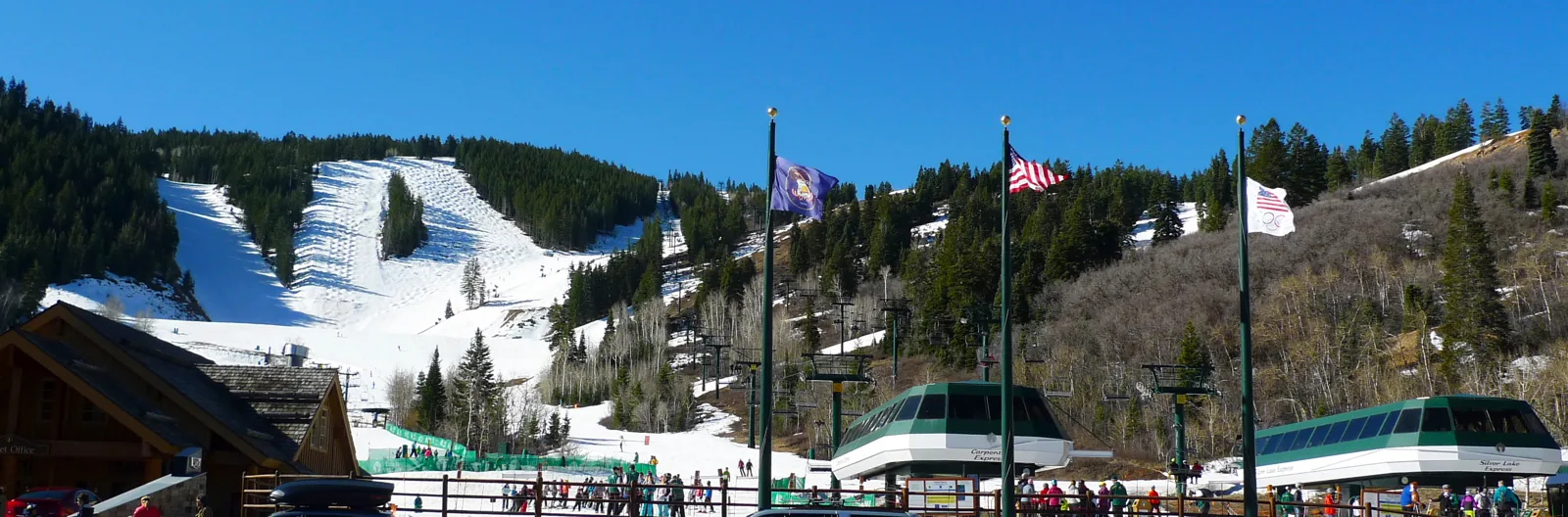 The Deer Valley base area with ski runs on the hills above Park City